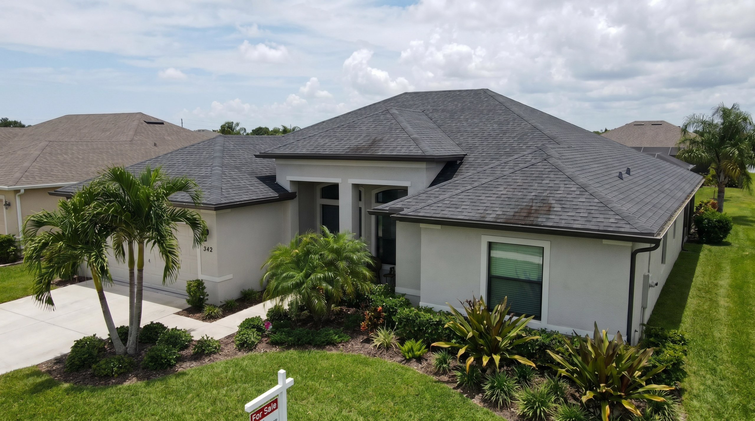 Roof repair cost Lake Park, FL - modern home with architectural shingle roof