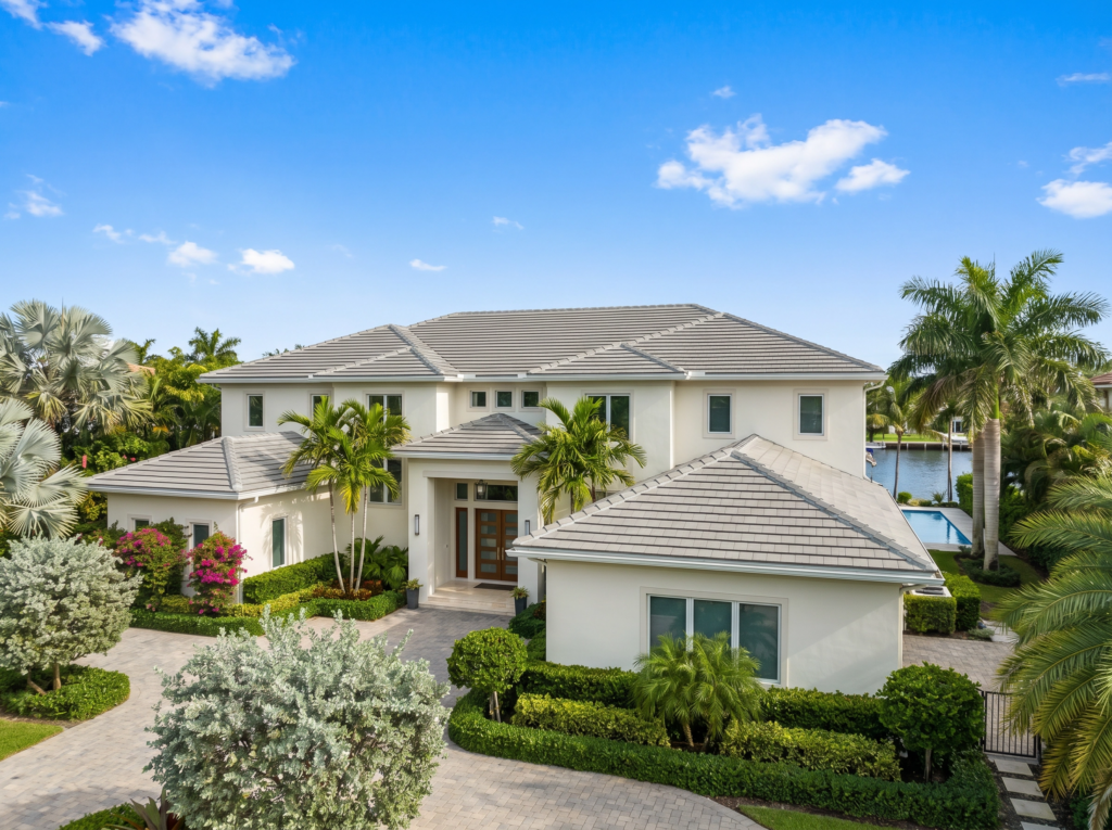 Premium concrete tile roof installation on a waterfront estate in Palm Beach Gardens by BLU Roofing.