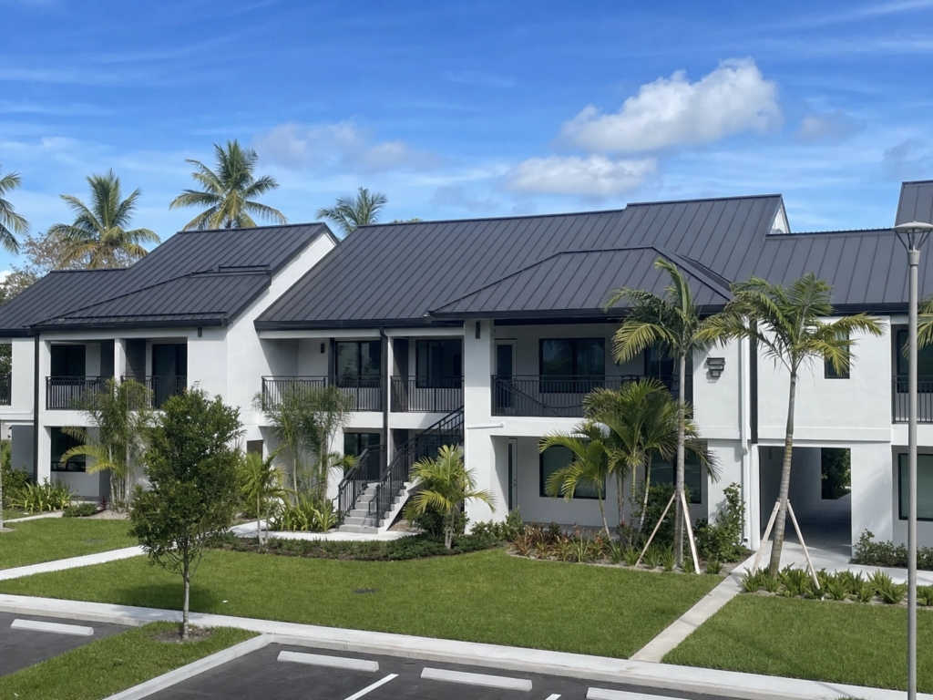 High-end apartment complex featuring dark bronze standing seam metal roofing in South Florida.