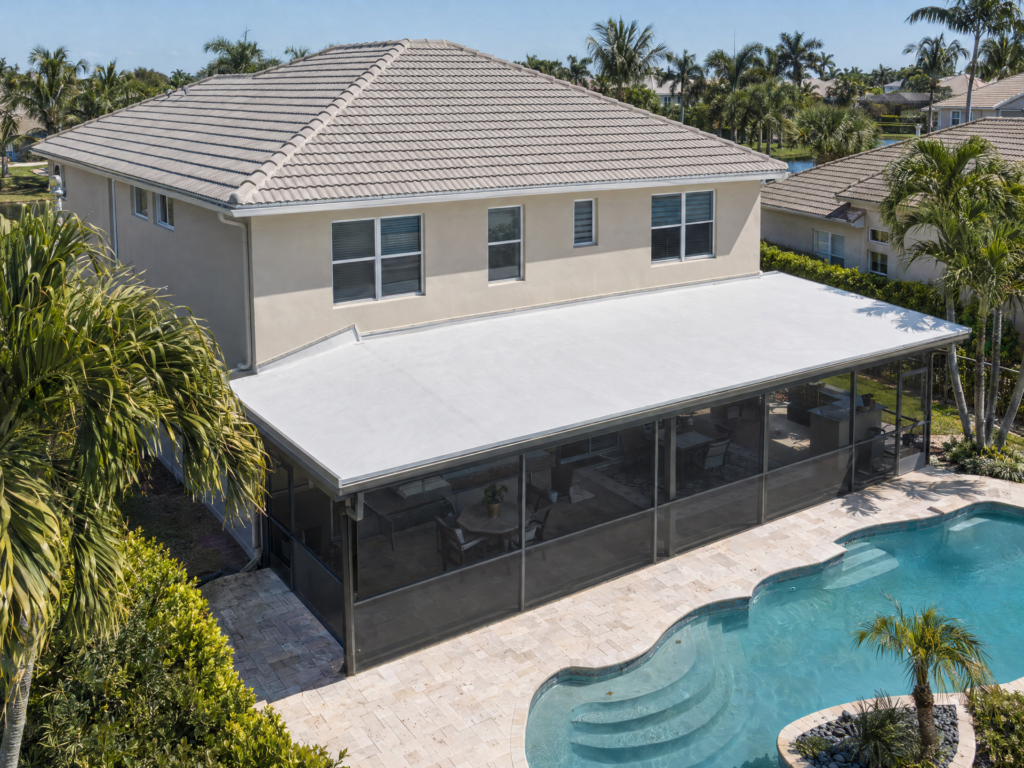 White-coated patio roof beside gray tile roof