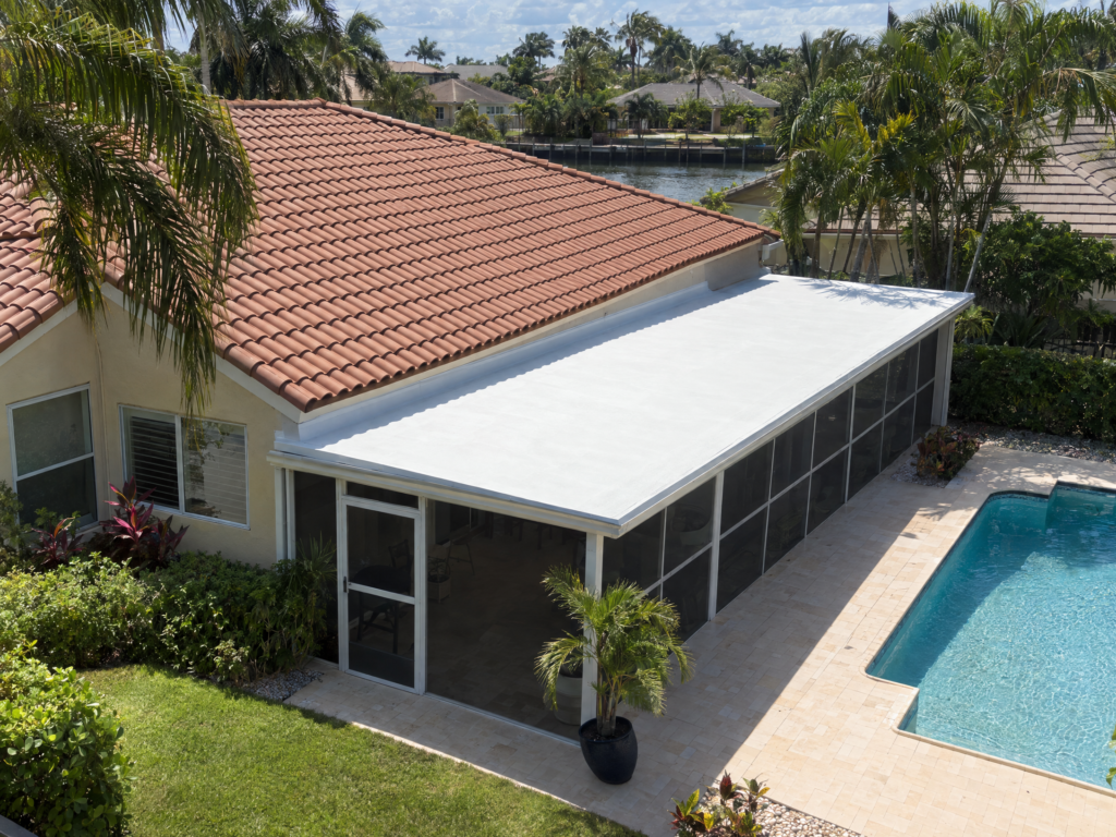 White silicone coated lanai roof beside terracotta tile roof